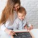 Mother and her little son learning to paint Mother and her little son learning to paint - PhotoDune Item for Sale