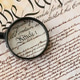 American USA Constitution paper page and magnifying glass close up American USA Constitution paper page and magnifying glass close up - PhotoDune Item for Sale