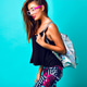 Stylish woman having fun at blue background. Stylish woman having fun at blue background. - PhotoDune Item for Sale