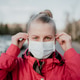 Portrait of Woman Wearing Protective Mask Against Covid-19 Outdoors Portrait of Woman Wearing Protective Mask Against Covid-19 Outdoors - PhotoDune Item for Sale
