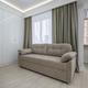 Small studio flat living room with a couch and a dining counter at windowsill Small studio flat living room with a couch and a dining counter at windowsill - PhotoDune Item for Sale