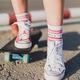 Girl on a skateboard. Legs in sneakers close-up Girl on a skateboard. Legs in sneakers close-up - PhotoDune Item for Sale