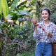 Female Coffee Farmer Holding Ripe Arabica Coffee Cherries at Plantation Female Coffee Farmer Holding Ripe Arabica Coffee Cherries at Plantation - PhotoDune Item for Sale