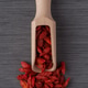 Wooden scoop with dry red goji berries Wooden scoop with dry red goji berries - PhotoDune Item for Sale