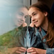 A young girl looks out the window of a train at the sea. A young girl looks out the window of a train at the sea. - PhotoDune Item for Sale