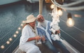 Senior couple toasting champagne while taking selfie on sailboat vacation Senior couple toasting champagne while taking selfie on sailboat vacation - PhotoDune Item for Sale