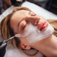 Female model with long blonde hair is receiving a facial treatment in a spa Female model with long blonde hair is receiving a facial treatment in a spa - PhotoDune Item for Sale