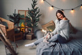 portrait of a beautiful European girl in the light of Christmas garlands, joyful enjoying home comfo portrait of a beautiful European girl in the light of Christmas garlands, joyful enjoying home comfo - PhotoDune Item for Sale