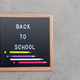 Flat lay of blackboard with wooden frame with message says Back To School decorated with pencils Flat lay of blackboard with wooden frame with message says Back To School decorated with pencils - PhotoDune Item for Sale