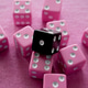 A Black Die Atop A Scattered Group Of Pink Dice On A Pink Background A Black Die Atop A Scattered Group Of Pink Dice On A Pink Background - PhotoDune Item for Sale