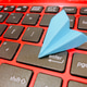 Paper plane origami on keyboard Paper plane origami on keyboard - PhotoDune Item for Sale