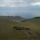Baikal region. Dirt road on Tazheranskaya steppe near the stone rocks, called the Valley of the Baikal region. Dirt road on Tazheranskaya steppe near the stone rocks, called the Valley of the - PhotoDune Item for Sale