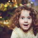 A beautiful little girl near christmas tree. A beautiful little girl near christmas tree. - PhotoDune Item for Sale