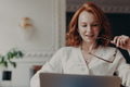 Pleased redhead woman student watches training webinar, Pleased redhead woman student watches training webinar, - PhotoDune Item for Sale