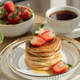 Pancakes with Strawberries and Coffee. Breakfast on Sunny Morning Pancakes with Strawberries and Coffee. Breakfast on Sunny Morning - PhotoDune Item for Sale
