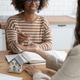 Close-up of happy woman realtor or property owner handing over key to house. Close-up of happy woman realtor or property owner handing over key to house. - PhotoDune Item for Sale