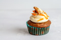 A single carrot cake muffin on white background with copy space, horizontal A single carrot cake muffin on white background with copy space, horizontal - PhotoDune Item for Sale