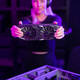 Female gamer in her 20s upgrades a gaming PC with high-end graphics card in neon-lit setup Female gamer in her 20s upgrades a gaming PC with high-end graphics card in neon-lit setup - PhotoDune Item for Sale