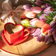 Heart Shaped Coffee Cup with Tulips on Bed. Romantic Valentines Day Celebration Heart Shaped Coffee Cup with Tulips on Bed. Romantic Valentines Day Celebration - PhotoDune Item for Sale