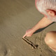 man 65 years old, gray-haired, draws a finger on the wet sand on the beach, close-up man 65 years old, gray-haired, draws a finger on the wet sand on the beach, close-up - PhotoDune Item for Sale