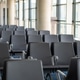 Interior of airport terminal with empty seats in a row in departure area of airport without people Interior of airport terminal with empty seats in a row in departure area of airport without people - PhotoDune Item for Sale