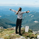 Freedom concept: girl standing on top of a mountain Freedom concept: girl standing on top of a mountain - PhotoDune Item for Sale