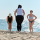 Group yoga stretching on Sandy Beach by Baltic Sea under clear sky Group yoga stretching on Sandy Beach by Baltic Sea under clear sky - PhotoDune Item for Sale