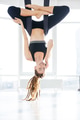 Cheerful woman doing aerial yoga and talking on mobile phone Cheerful woman doing aerial yoga and talking on mobile phone - PhotoDune Item for Sale