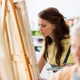 student girl with easel painting at art school student girl with easel painting at art school - PhotoDune Item for Sale