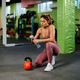 Sporty woman opening water bottle after kettlebell workout in gym Sporty woman opening water bottle after kettlebell workout in gym - PhotoDune Item for Sale