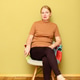a mature woman sitting in a colorful patchwork chair. Elegant middle-aged female a mature woman sitting in a colorful patchwork chair. Elegant middle-aged female - PhotoDune Item for Sale