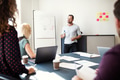 Manager giving a presentation to his team in an office Manager giving a presentation to his team in an office - PhotoDune Item for Sale