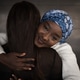 Young black female best friends hugging on street Young black female best friends hugging on street - PhotoDune Item for Sale