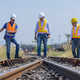 Engineers Inspecting Railway Switch and Track at Station Engineers Inspecting Railway Switch and Track at Station - PhotoDune Item for Sale