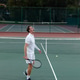 Man in his 30s wearing white tennis attire standing on outdoor court holding racket, watching ball Man in his 30s wearing white tennis attire standing on outdoor court holding racket, watching ball - PhotoDune Item for Sale