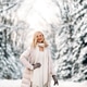 Fashion young smiling blonde woman in winter. Standing among snowy trees in winter forest. Fashion young smiling blonde woman in winter. Standing among snowy trees in winter forest. - PhotoDune Item for Sale