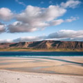 Coast in the Iceland. Sand, sea and sky with clouds. Natural landscape at the summer time. Coast in the Iceland. Sand, sea and sky with clouds. Natural landscape at the summer time. - PhotoDune Item for Sale