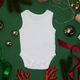 white bodysuit on a green background with christmas holiday theme white bodysuit on a green background with christmas holiday theme - PhotoDune Item for Sale