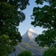 The Watzmann peak seen through trees The Watzmann peak seen through trees - PhotoDune Item for Sale