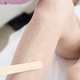 hands wearing protective medical gloves applying gel using spatula on woman's leg hands wearing protective medical gloves applying gel using spatula on woman's leg - PhotoDune Item for Sale