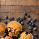 Homemade Blueberry Muffins and Fresh Blueberries on Dark Rustic Wooden Table with Copy Space Homemade Blueberry Muffins and Fresh Blueberries on Dark Rustic Wooden Table with Copy Space - PhotoDune Item for Sale