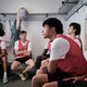 Soccer team listening during coaching session in locker room Soccer team listening during coaching session in locker room - PhotoDune Item for Sale