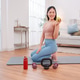 Woman taking a break after home workout, sitting on yoga mat with dumbbells Woman taking a break after home workout, sitting on yoga mat with dumbbells - PhotoDune Item for Sale