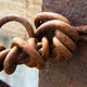 Rusty metal rod tied in a knot. Corrosion of old metal. Metal and ...