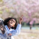 Smiling child looking out of car window under pink blossoms, happy family travel lifestyle Smiling child looking out of car window under pink blossoms, happy family travel lifestyle - PhotoDune Item for Sale
