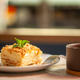 Delicious napoleon cake being served with tea in a cafe Delicious napoleon cake being served with tea in a cafe - PhotoDune Item for Sale