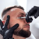 Male patient receiving cosmetic treatment with syringe in a modern clinic Male patient receiving cosmetic treatment with syringe in a modern clinic - PhotoDune Item for Sale
