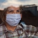 Elderly caucasian woman wearing handmade protective face mask Elderly caucasian woman wearing handmade protective face mask - PhotoDune Item for Sale