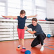 Girl performing a motoric balance training exercise on sensory stability pods Girl performing a motoric balance training exercise on sensory stability pods - PhotoDune Item for Sale
