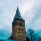 Historic church tower in Enschede, Netherlands, under a cloudy sky. Historic church tower in Enschede, Netherlands, under a cloudy sky. - PhotoDune Item for Sale